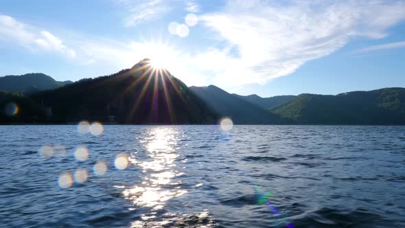 Mountain lake with big waves caused by wind. Beautiful mountain lake. Sailing on a mountain lake.