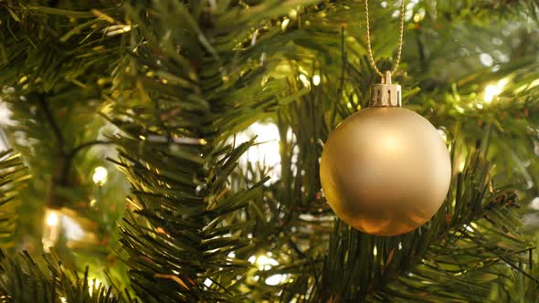 Golden matte color  Christmas ornament 4K 2160p 30fps UltraHD footage - Sparkling lights and bauble 