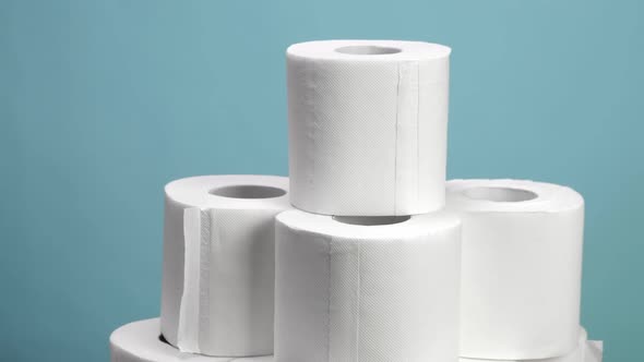 A Lot of Toilet Paper Closeup on Blue Background