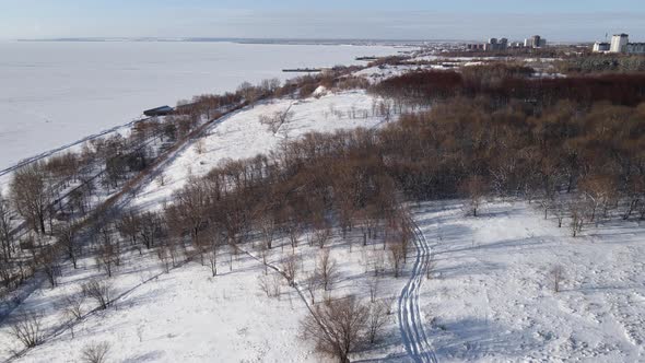 Aerial winter panorama view of the neighborhood on the banks of the river