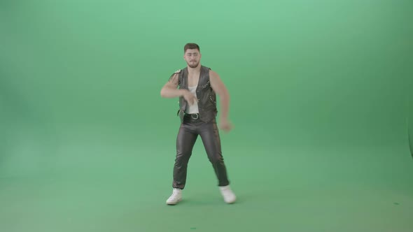 Angry Caucasian Man In Black Leather Costume Dancing Pop Moves On Green Screen   4 K Video Footage