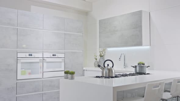 Tracking shot of a luxury kitchen with gray modern design