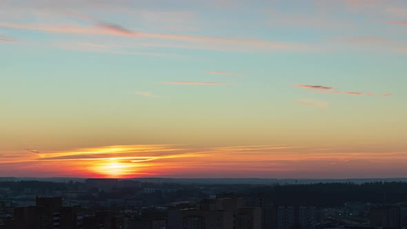 beautiful timelapse with sunset in the city and dramatic sky