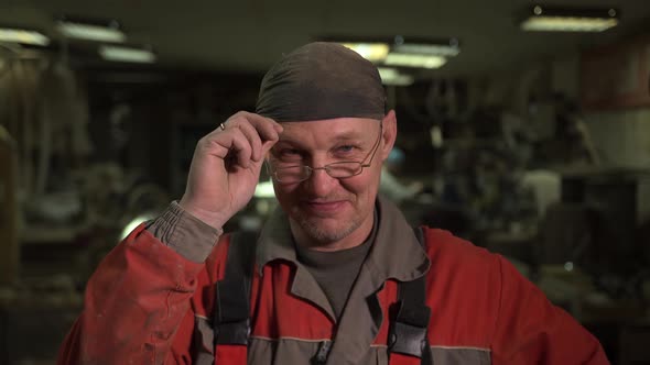 Portrait of Lumberjack on Wood Furniture Production Looking at Camera