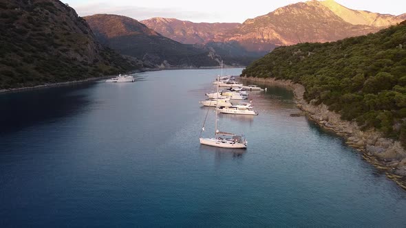 The Flight of the Drone Over the Yachts That are Anchored