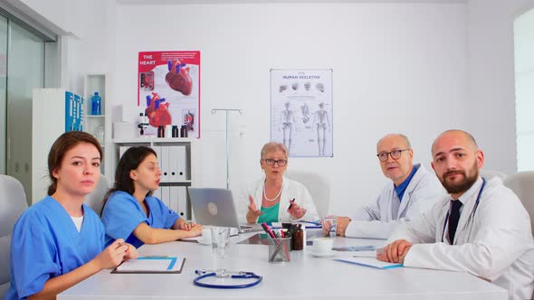 Group of Specialist Doctors Having Video Meeting