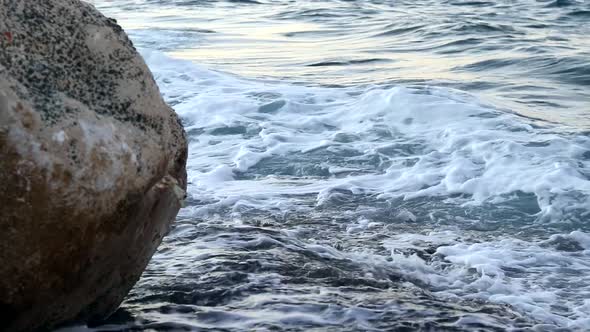 A Beautiful Closeup Shot of a Rocky Beach Washed By Ocean Waves