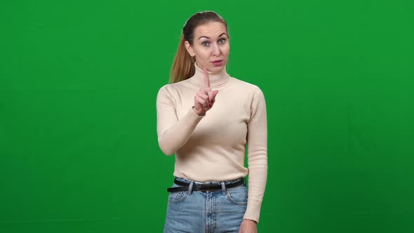 Serious Woman Shaking Finger Gesturing No on Green Screen