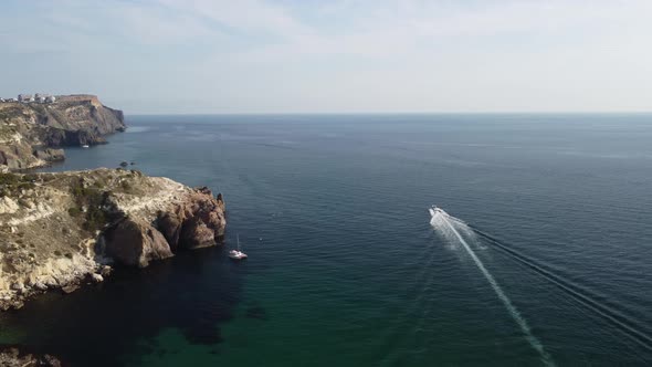 Aerial Panoramic View of Seascape with Crystal Clear Azure Sea and Rocky Shores