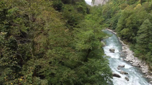 Aerial view from a drone on a river in the mountains. Drone crash.