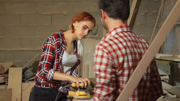 Two Carpenters Working on Wood Plank at the Workshop 1080p