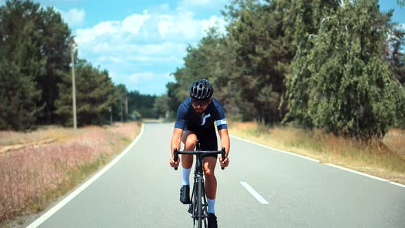 Fit Athlete Sport Workout Training Cycling Triathlon Competition. Cyclist Fitness Riding On Road.