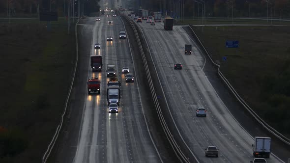 Cars Traveling on the Highway Road in Dusk