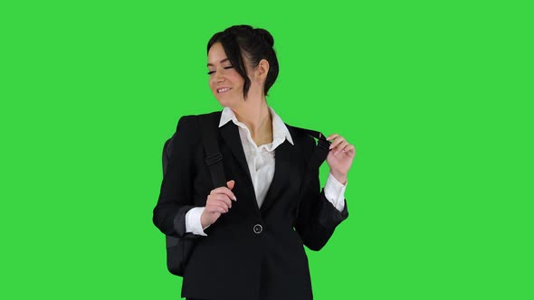 Beautiful Girl with a Backpack Dancing on a Green Screen, Chroma Key