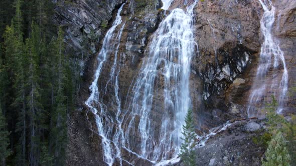 Drone ascending showing a set of waterfalls in a natural rocky environment in Canada. Waterfall, nat