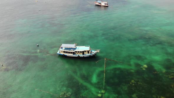 Dive Boats with Equipment in Sea. Motor Dive Boats with Equipment and Tanks Floating on Blue Sea