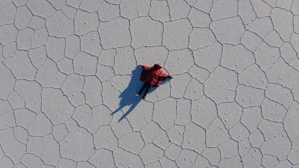 Man in Poncho at Salar De Uyuni Aitiplano Bolivia