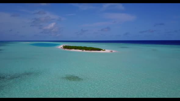 Aerial drone shot seascape of marine resort beach holiday by shallow water with white sandy backgrou