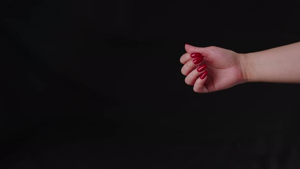 Crop woman with red nail polish.