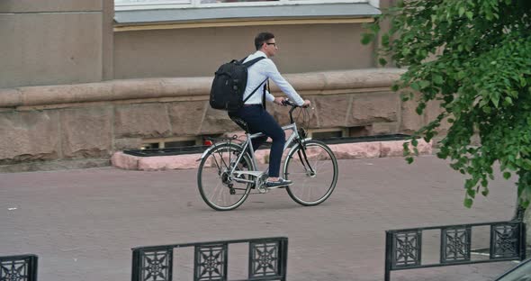 Office Worker Riding Bike alt