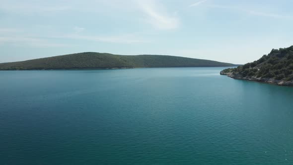 Aerial panorama shot of small island group on a sunny day. Aerial shot of the area around Luca beach