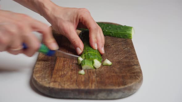 Woman Cuts Vegetables on a Cutting Board for Cooking Homemade Vegetable Salad