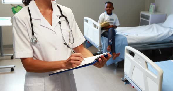 Female doctor writing a report