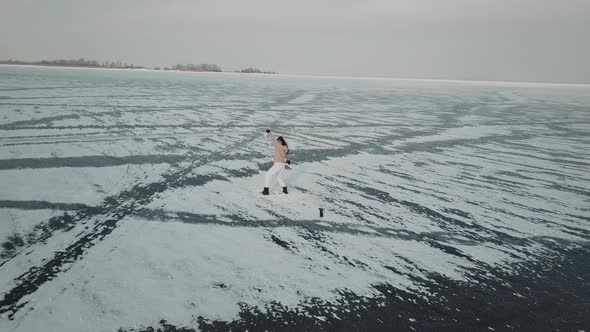 Stylish Young Woman Professional Dancer Dancing Energetic Jazz Funk or Hip Hop on Arctic Frozen Lake