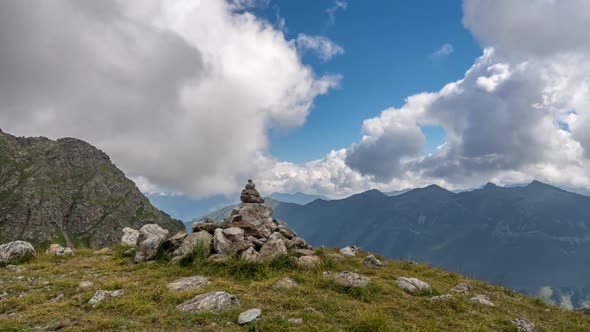 Puffy clouds over the mountains.