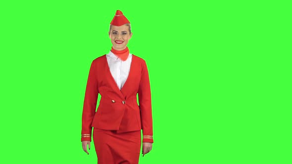 Stewardess Goes and Welcomes Others. Green Screen