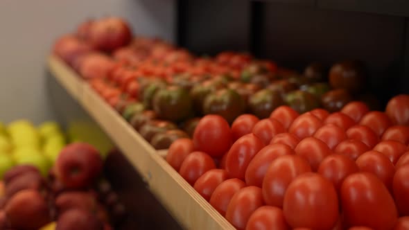 Female Hand Taking Vegetables From Store Shelf