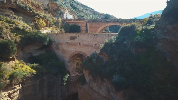 Aerial view of two old  bridges over a big ravine from different periods.The older one from the span