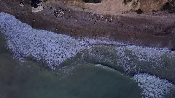 Aerial Top View Waves Break on Beach