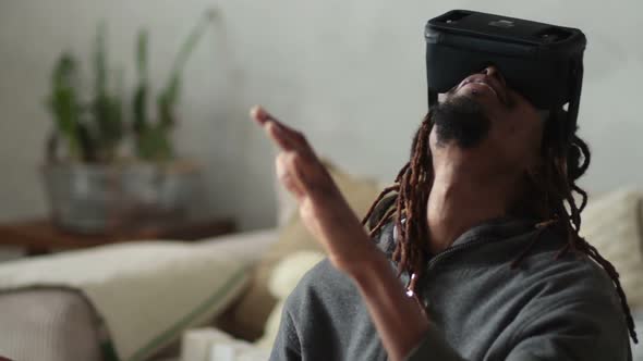Man with Virtual Reality Headset Playing Video Games alt