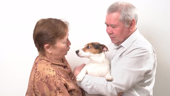 An Elderly Couple with a Dog on a White Background