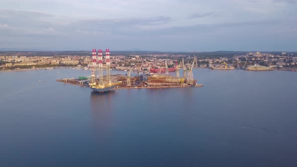 Shipyard With Mediterranean City On Background