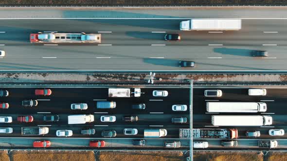 Cars Casting Shadows Move Along Lane with Light Asphalt