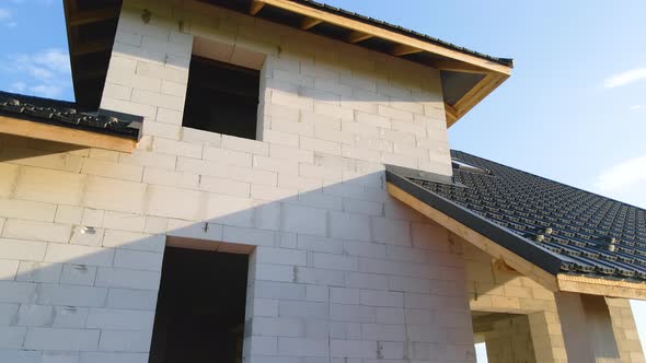 Unfinished Frame of Private House with Aerated Lightweight Concrete Walls and Metal Rooftop Under