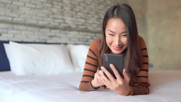 Young asian woman use smart phone