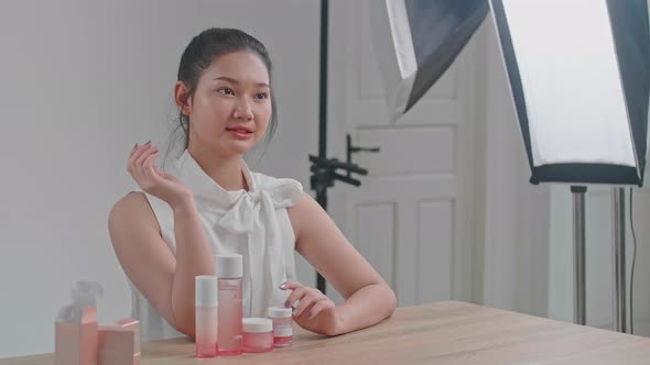 Behind The Scenes On Photo Shoot: Beautiful Asian Model Poses For A Photographer