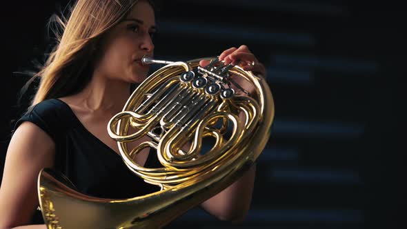 Young Beautiful Plays the French Horn