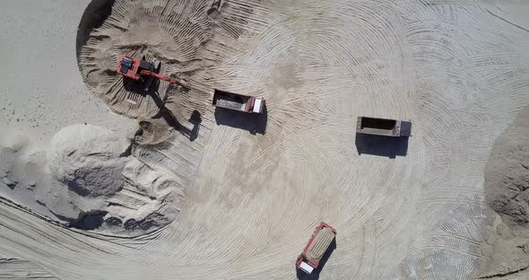 Excavator Fills Tipper with Ore at Sand Quarry Aerial View