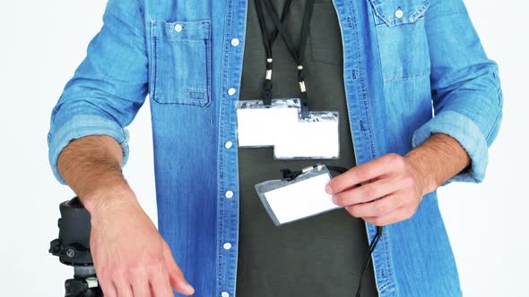 Portrait of photographer showing identity card