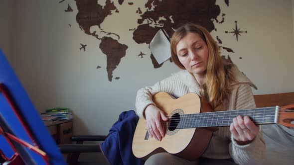 Woman Playing Guitar