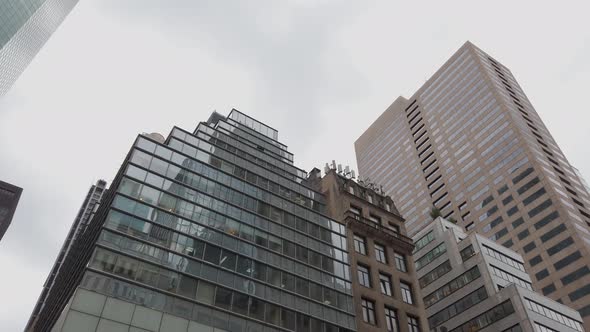 New York City, USA. Low Angle of Corporate Buildings at Wall Street, Manhattan. Slow Motion