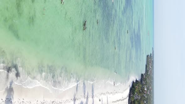 Vertical Video Boats in the Ocean Near the Coast of Zanzibar Tanzania Aerial View