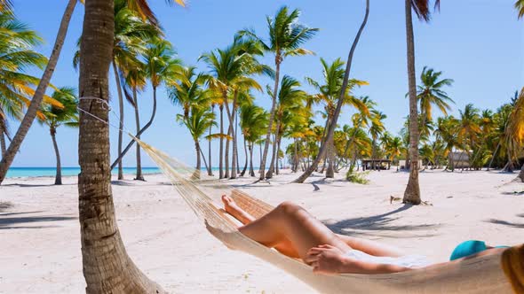 Woman lying in hammock