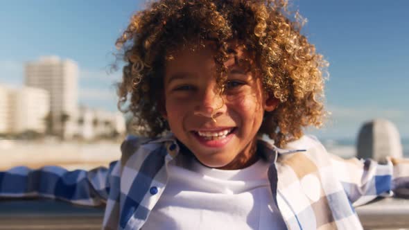 Little boy smiling and looking at camera