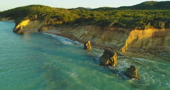 Popa beach cliffs in Dominican Republic. Aerial circling