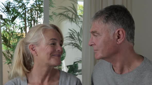 Close up of mature couple smiling at each other